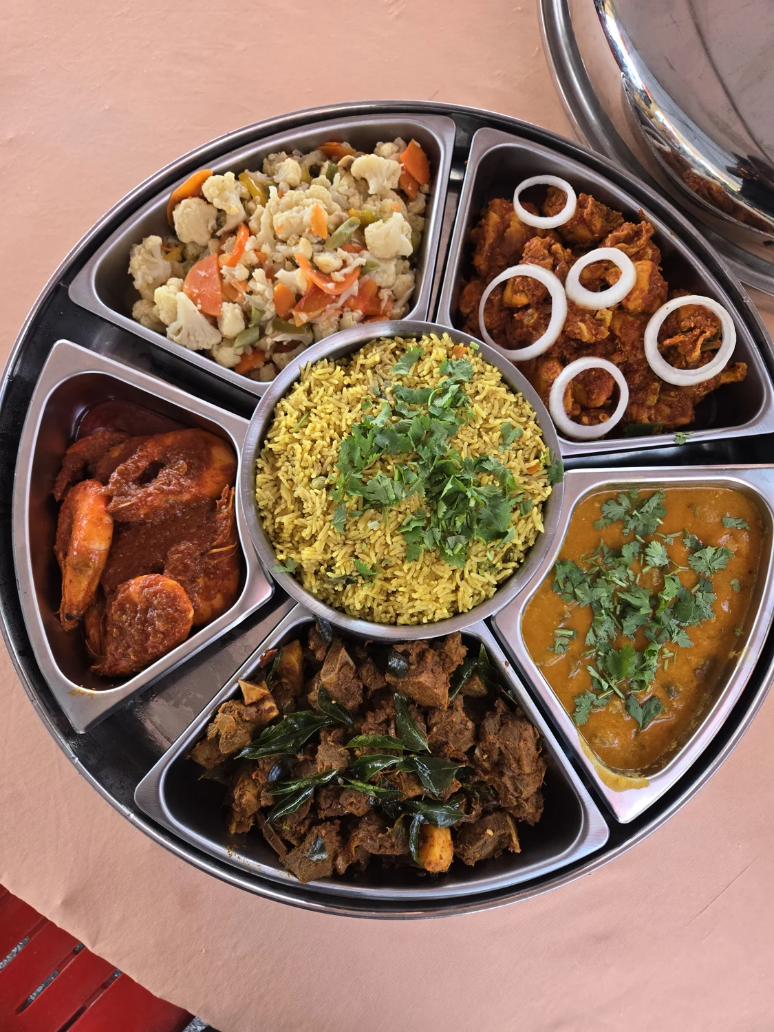 A sharing platter of rice and curries